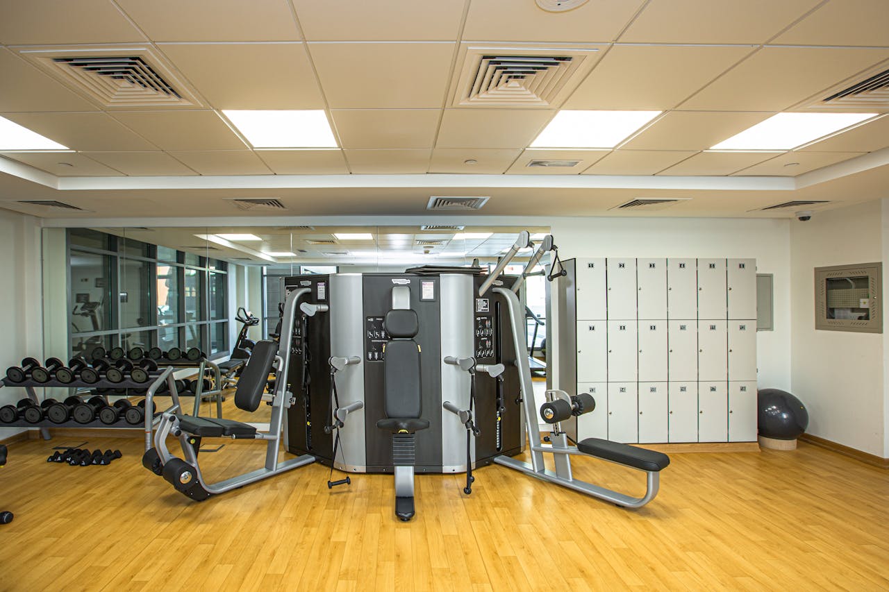 Spacious gym interior showcasing modern exercise equipment and storage lockers.