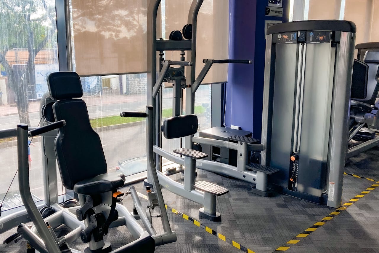 High-quality gym equipment set in a bright, indoor fitness center.